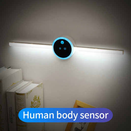 Wall-mounted light fixture with human body sensor label in a room setting.