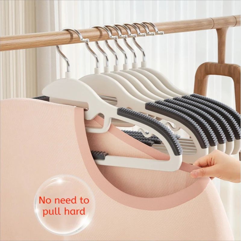 Set of hangers with a pink garment on a wooden rack, with text 'No need to pull hard'.
