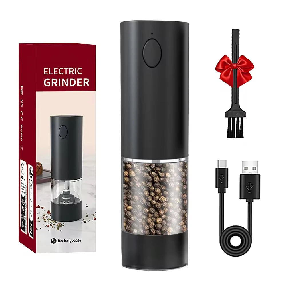 Black electric grinder with packaging, fork, and cable on a white background