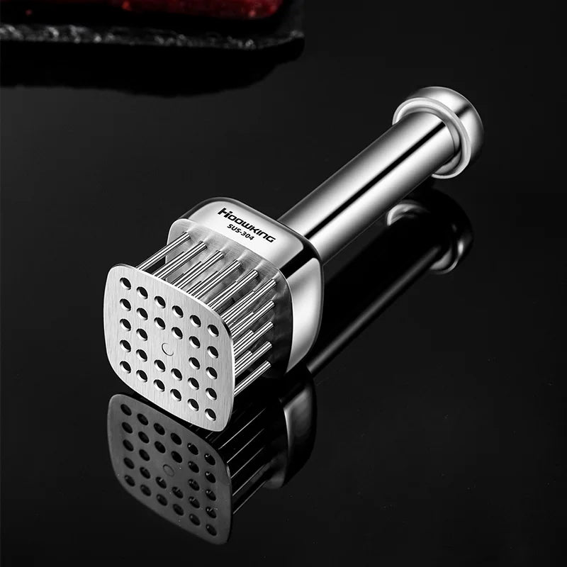 Stainless steel meat tenderizer on a black background