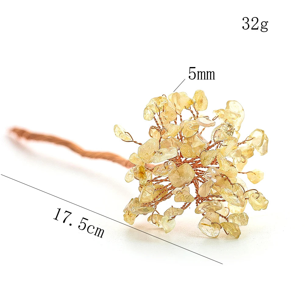 Gold floral hairpin with measurements on a white background
