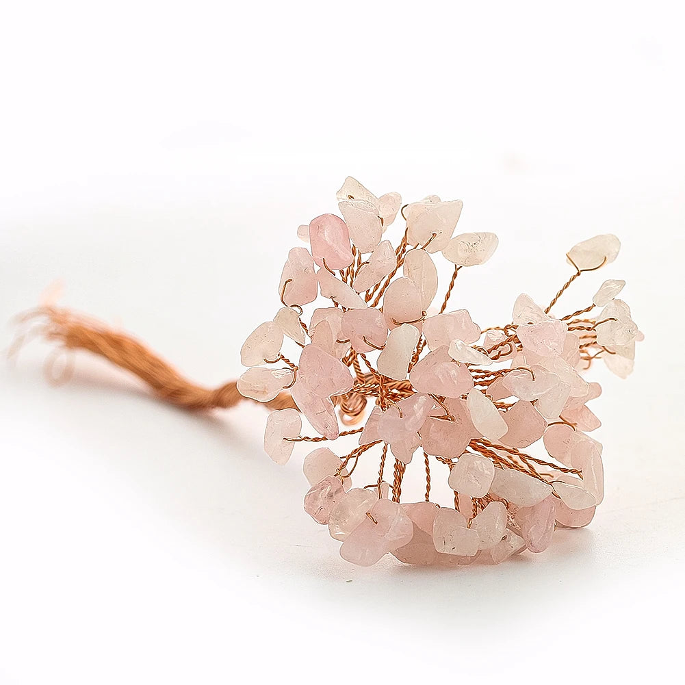 Bouquet of pink flowers with a tassel on a white background