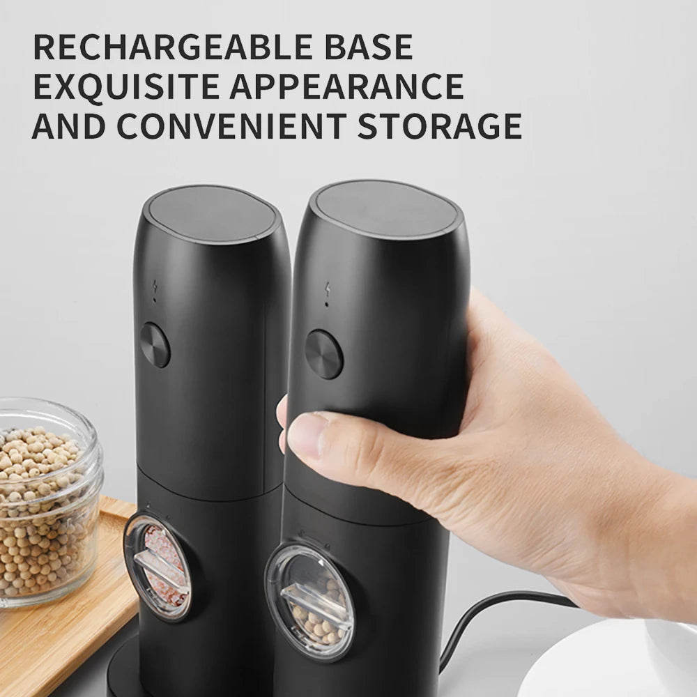 Black pepper grinder set with a hand holding one, on a light gray background.