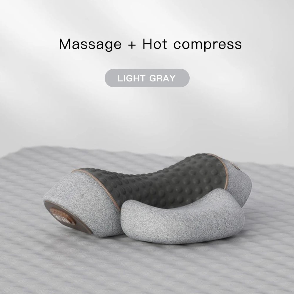 Light gray massage and hot compress pillow on a striped surface with 'Massage + Hot compress' text.