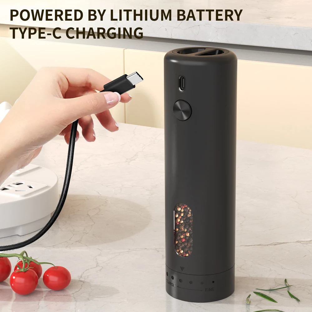 Black pepper grinder with USB charging cable on a kitchen counter