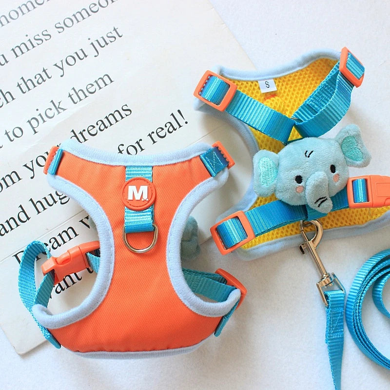 Orange and blue dog harness with a plush toy on a newspaper background