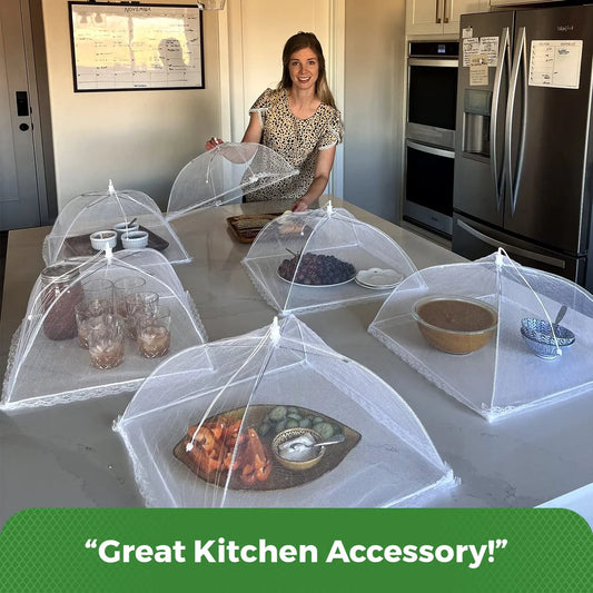 Woman in a kitchen with food covered by mesh covers, text 'Great Kitchen Accessory!' at the bottom.
