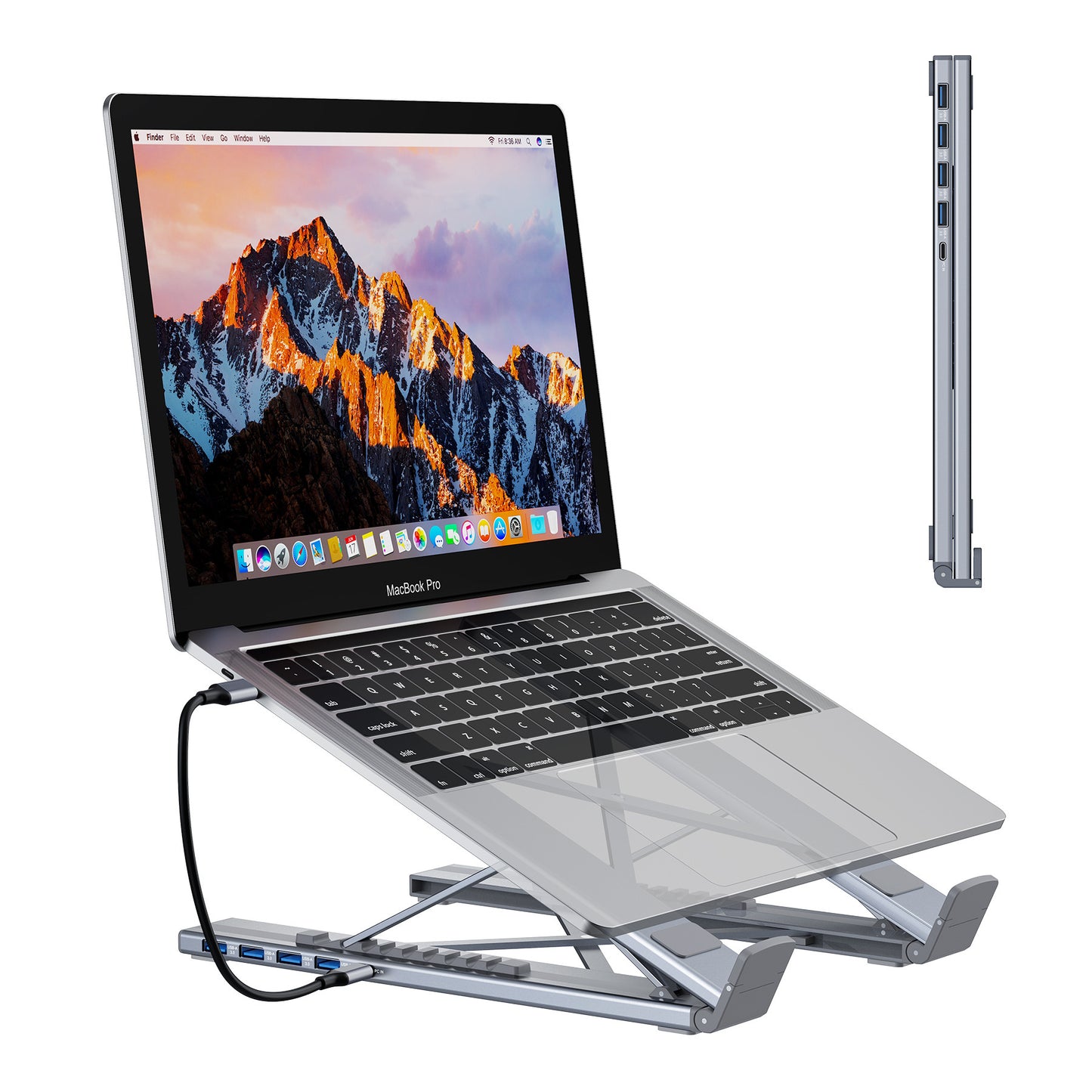 Laptop on a stand with a mountain-themed screen, showing ports on the side.