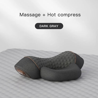 Dark gray massage and hot compress pillow on a textured surface with 'Massage + Hot compress' text above.