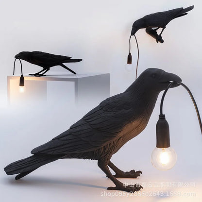 Decorative bird lamps with light bulbs inside on a white background
