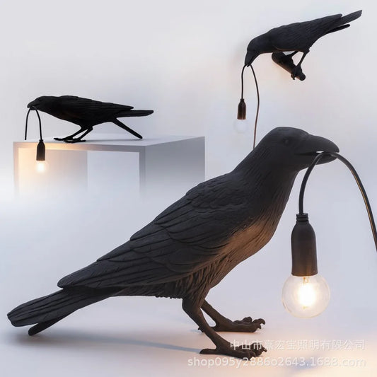 Decorative bird lamps with light bulbs inside on a white background