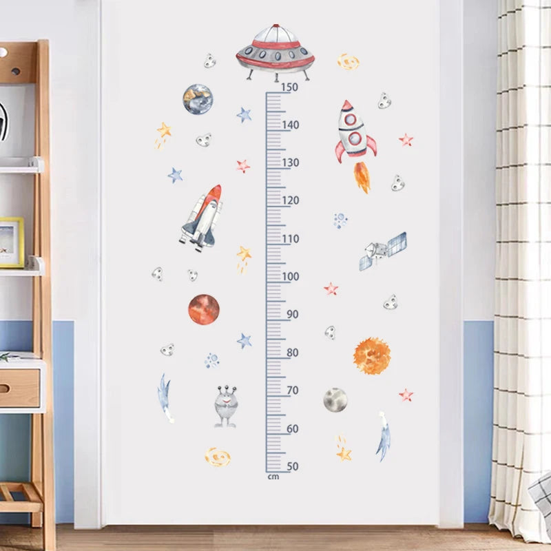 Children's room with space-themed wall decal height chart and decor elements.