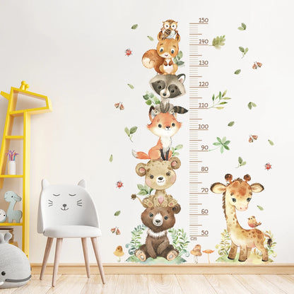 Woodland animal growth chart on a wall with a chair and shelves in a room.