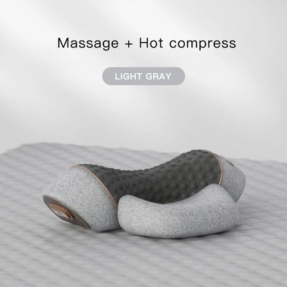 Light gray massage and hot compress pillow on a striped surface with 'Massage + Hot compress' text.