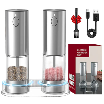 Electric salt and pepper grinders with packaging, fork, and cable on a white background