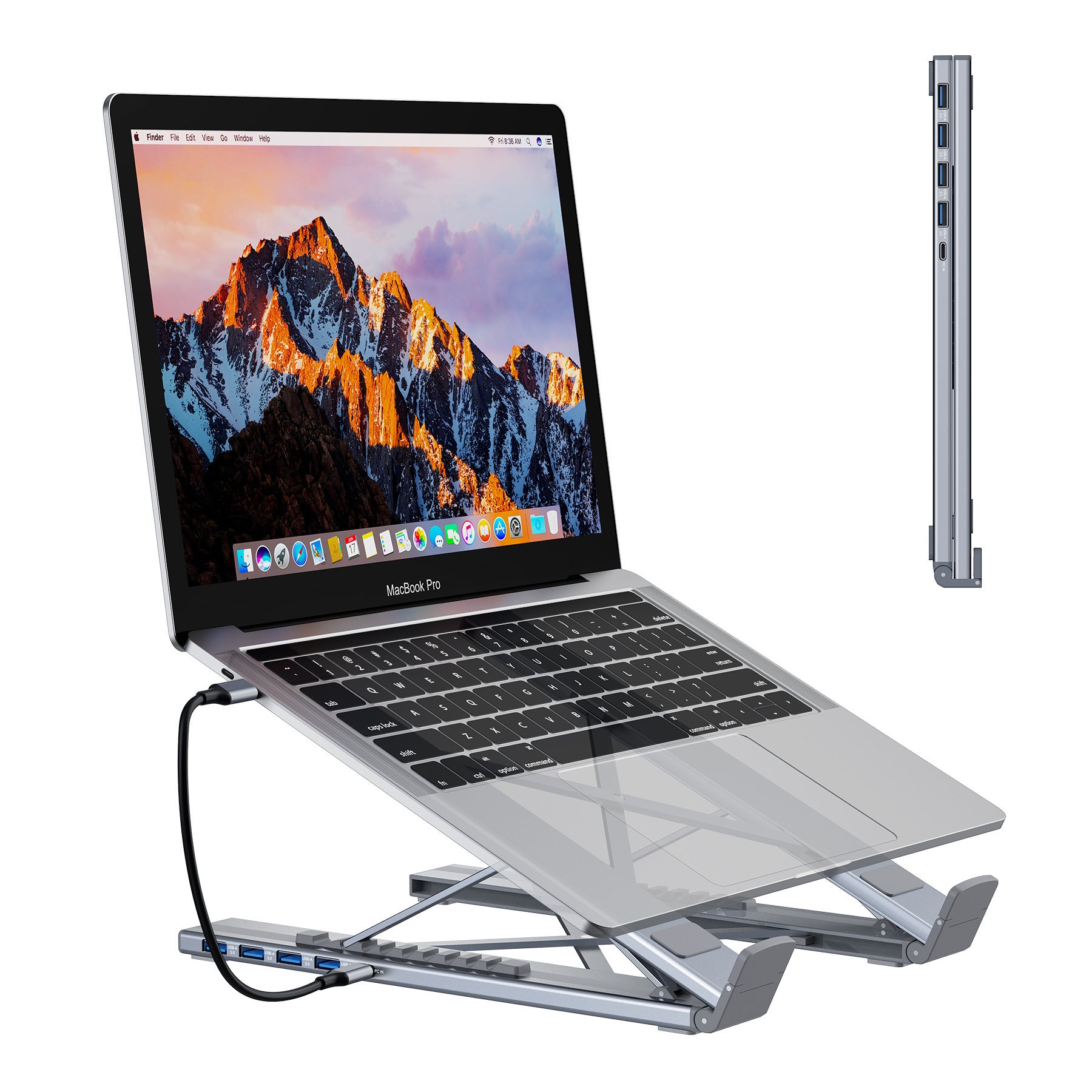 Laptop on a stand with a mountain-themed screen, showing ports on the side.