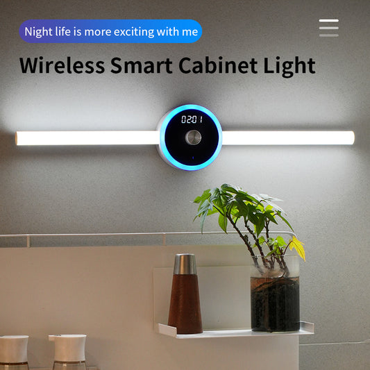 Wireless smart cabinet light on a wall with decorative elements below.